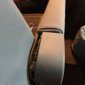Passenger seat, right armrest.